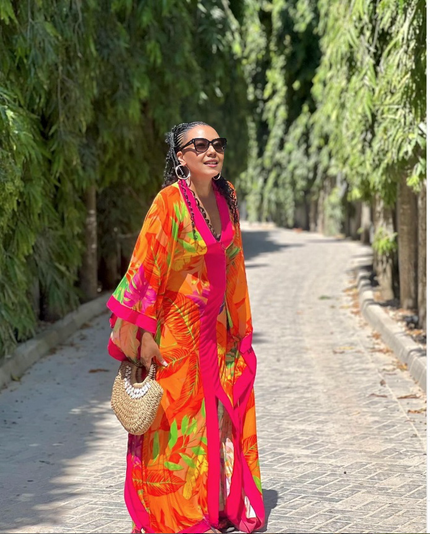 Maxi dress with tropical bird print, bright pink and orange, puff sleeves, V-neck