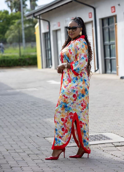 Floral maxi dress with red trim, long sleeves, side slit, full-length front view