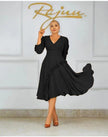 Black ruffle midi dress with long sleeves, V-neck bodice, and gathered flared skirt