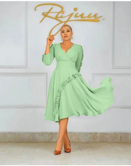 Mint green ruffle midi dress with long sleeves, V-neck bodice, and flared ruffle hem