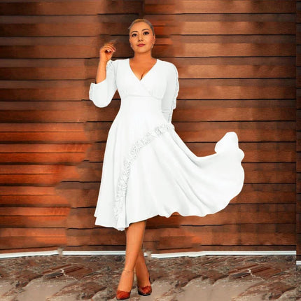 White ruffle midi dress with long sleeves, V-neck, and wide flared skirt with hem ruffle