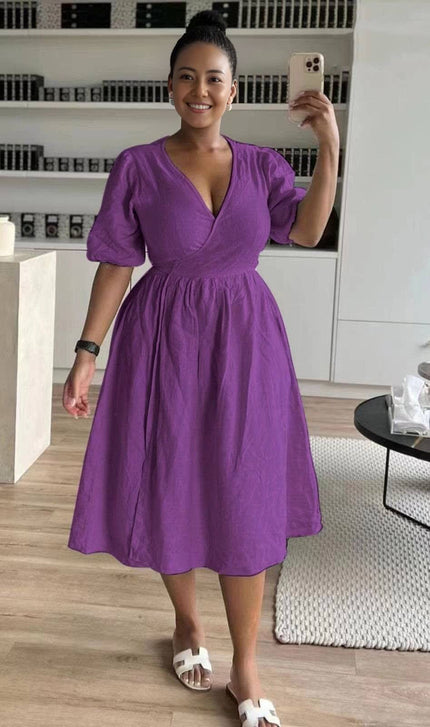 Purple wrap midi dress with puff sleeves and V-neck, gathered stretch waist