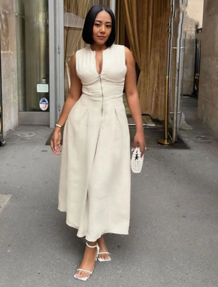 White midi dress with fitted bodice, sleeveless V-neck, gathered waist and flared skirt