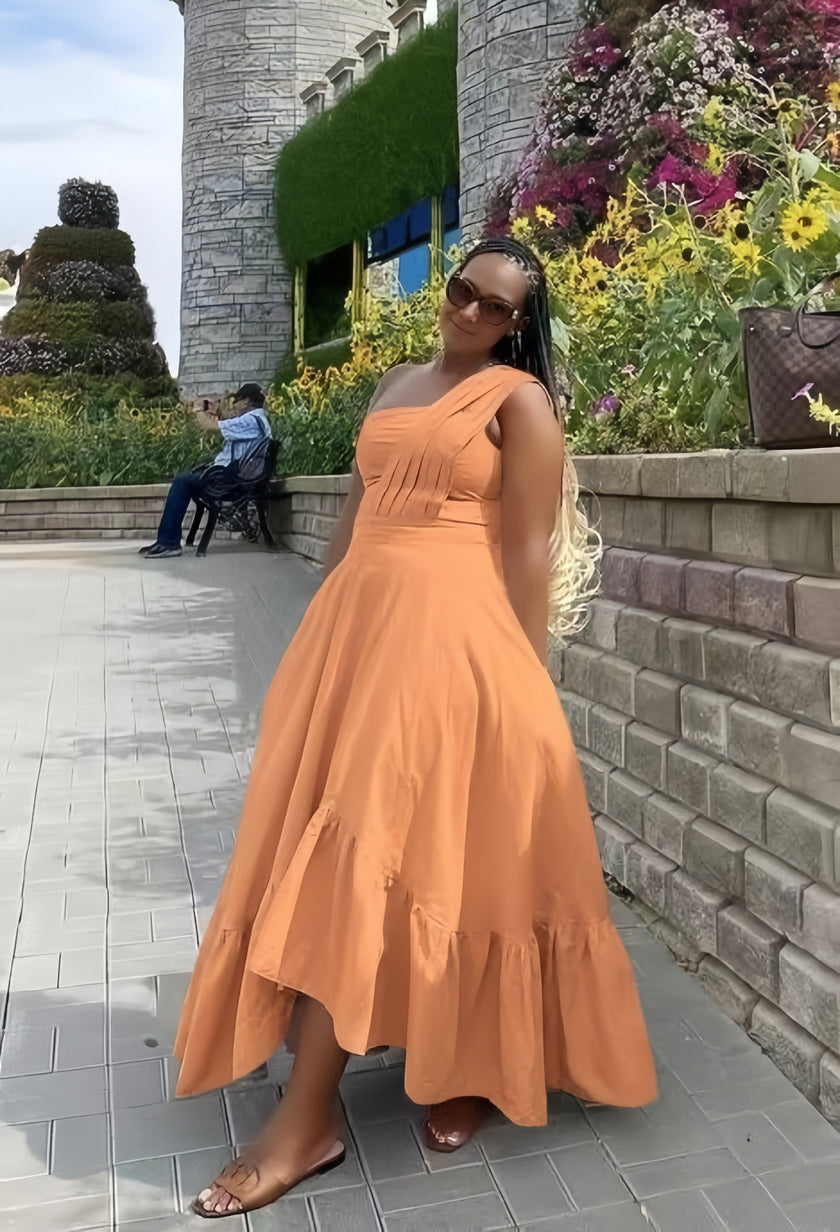 One-shoulder midi dress in orange with ruffle hem and fitted bodice