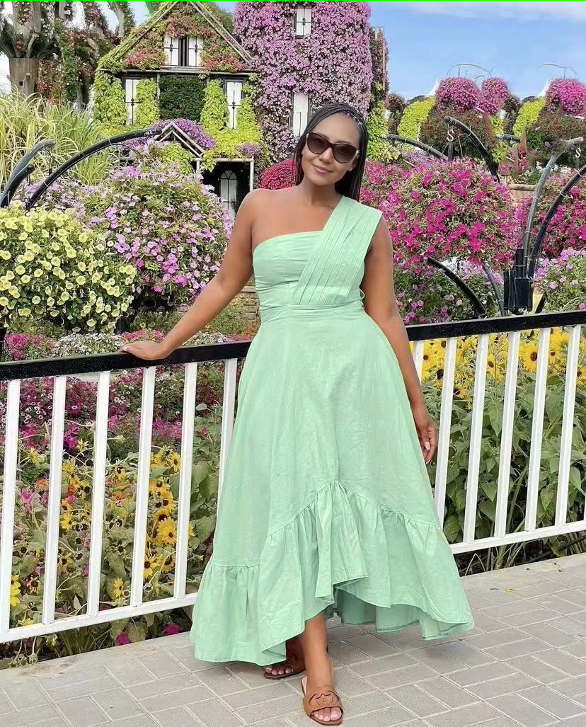 One-shoulder midi dress in mint green with ruffle hem and fitted bodice