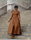 Coffee maxi dress with long sleeves, high neck, and gathered A-line skirt