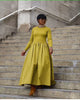 Yellow-green maxi dress with long sleeves and gathered A-line skirt