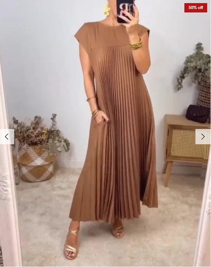 Sandy-brown pleated sleeveless maxi dress with round neckline and flowy skirt