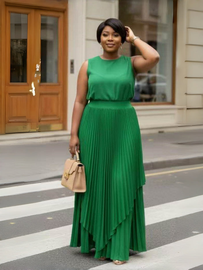 Green pleated maxi skirt with asymmetrical layered hem