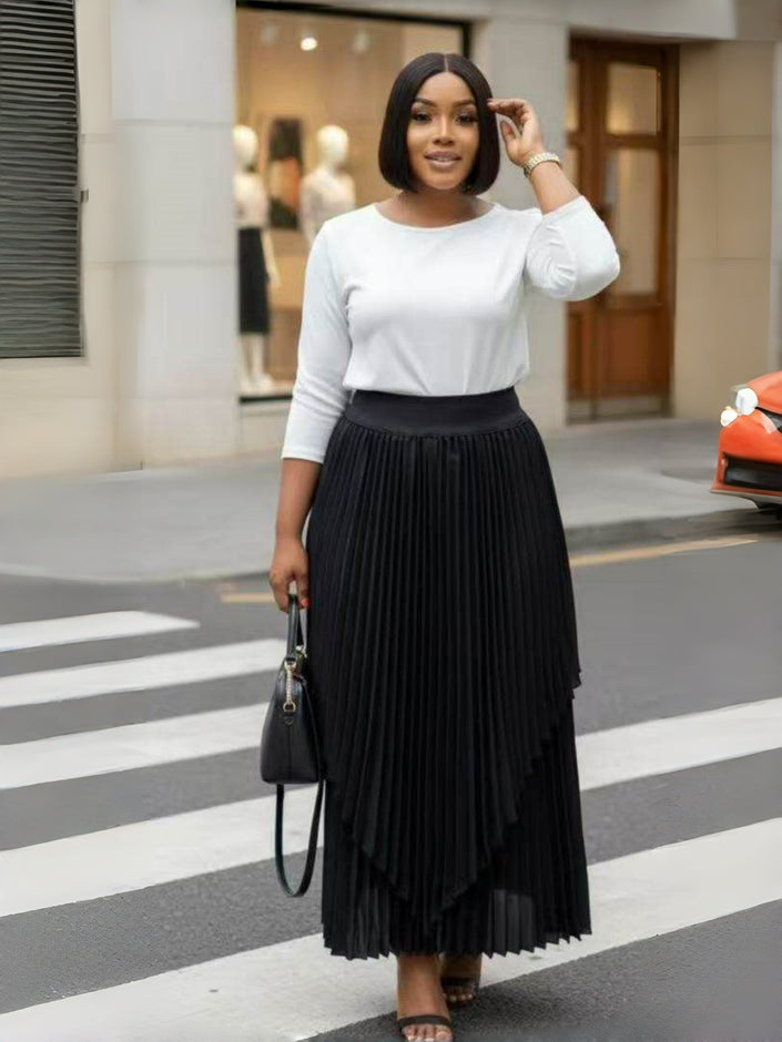Black pleated maxi skirt with asymmetrical layered hem