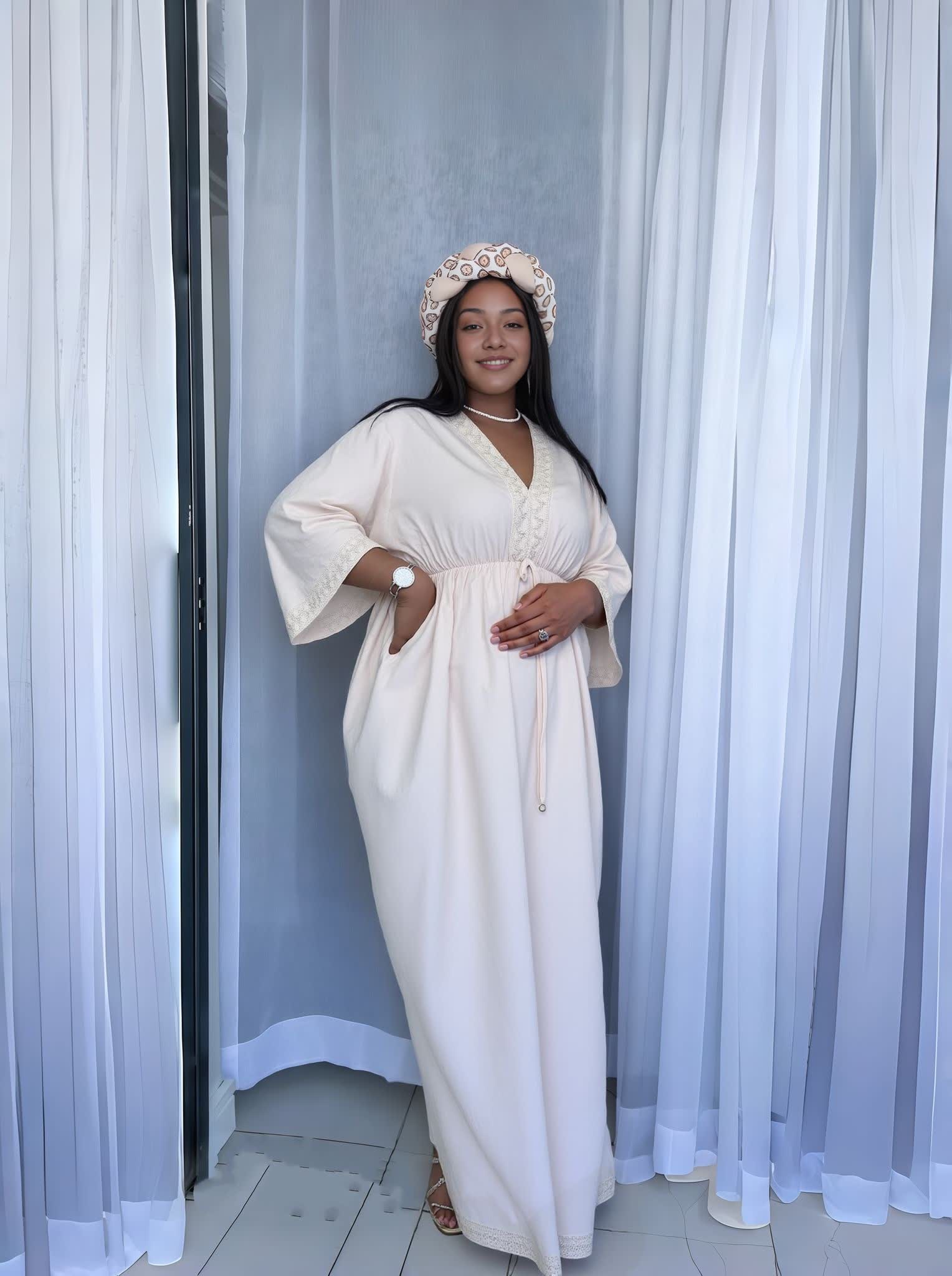 Beige maxi dress with V-neck, decorative button front, wide sleeves and belt tie