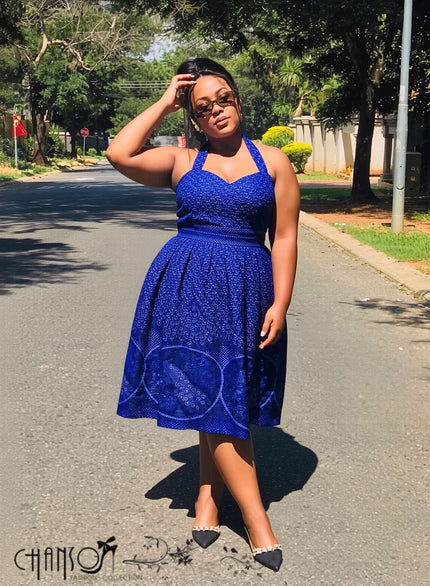 Blue halter midi dress with sweetheart neckline, fitted waist, jacquard texture, flared skirt