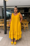 Yellow tiered maxi dress with V-neck and tie shoulder straps