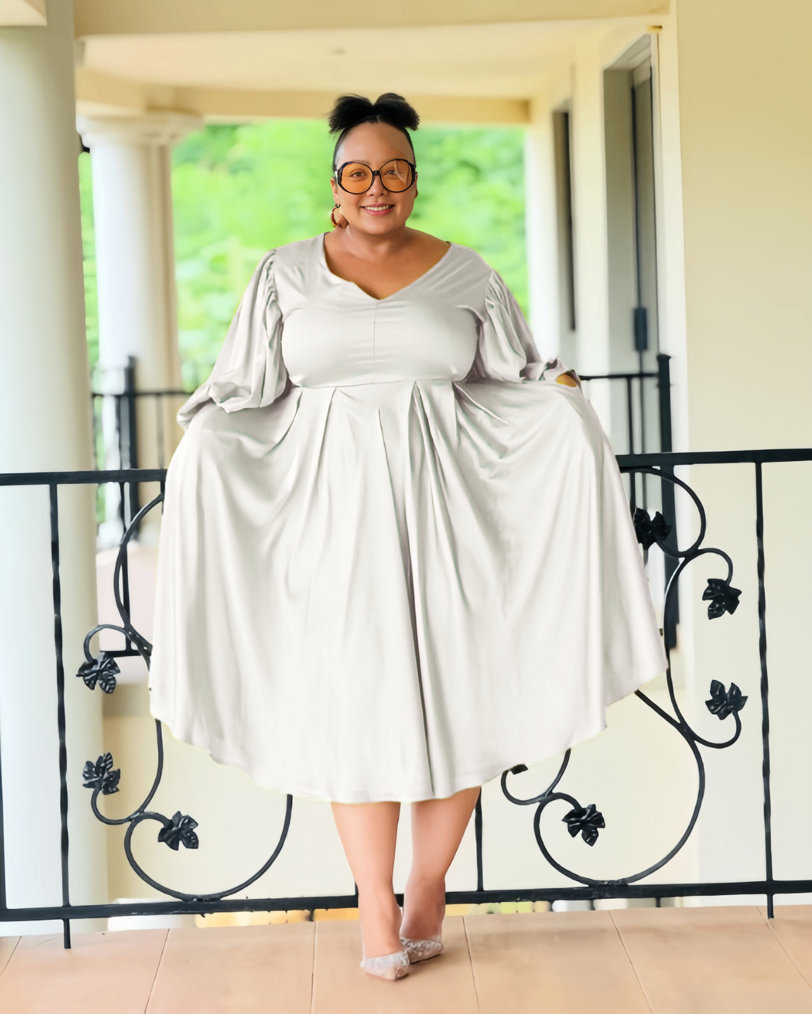 Plus-size midi dress in white with puff sleeves and pleated skirt