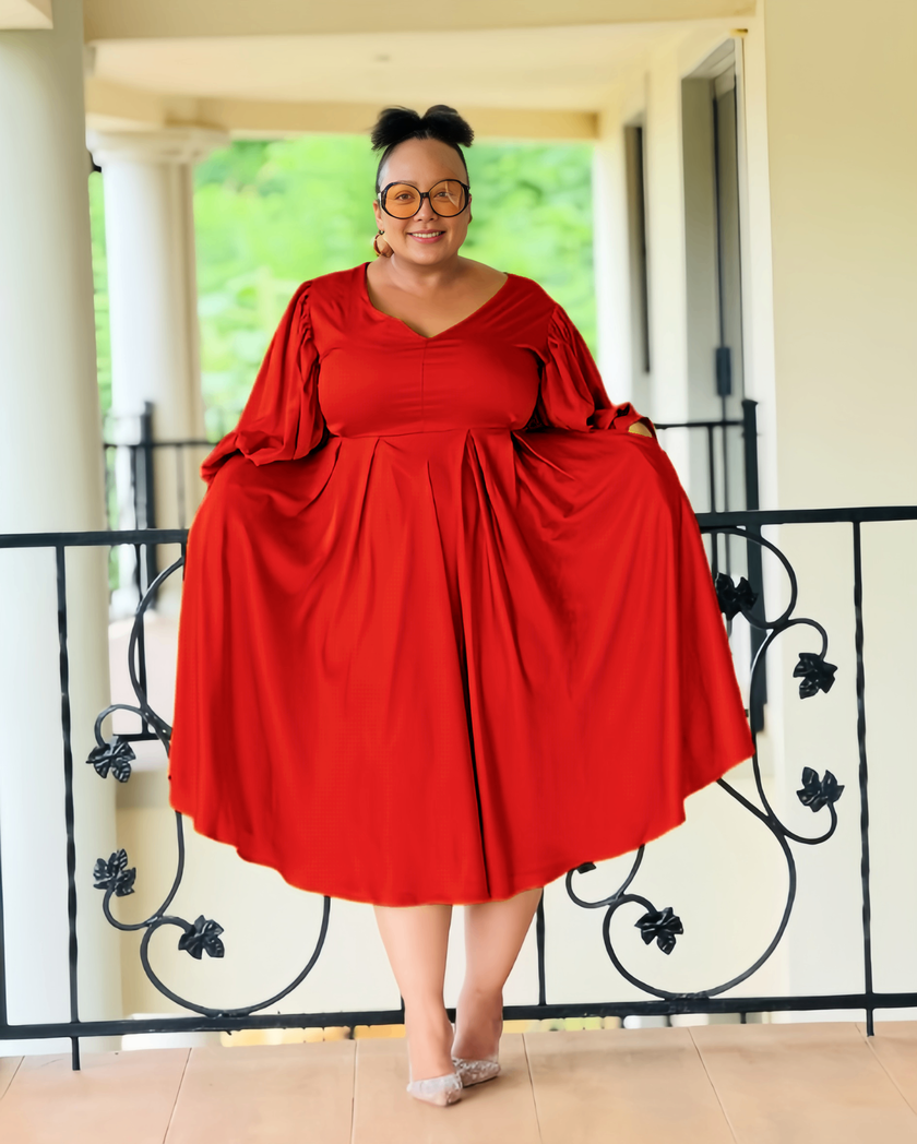 Plus-size midi dress in red with puff sleeves and pleated waist