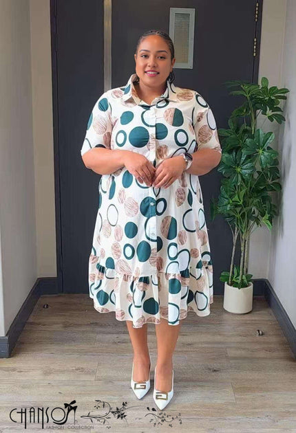 Plus-size shirt dress with teal-and-brown dot pattern, button-front and ruffled skirt