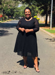 Black textured sheer midi dress with 3/4 sleeves, round neck, flared skirt