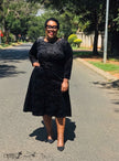 Black textured geometric midi dress with 3/4 flared sleeves