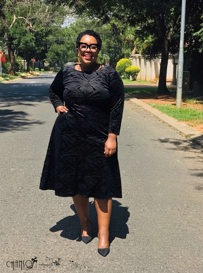 Black textured geometric midi dress with 3/4 flared sleeves