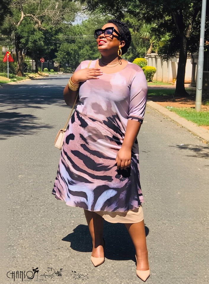 Plus size midi dress with abstract animal print, half sleeves and flared hem