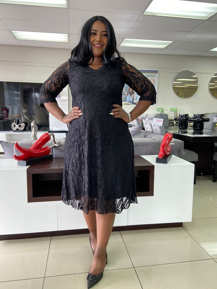 Black lace midi dress with floral overlay, 3/4 sleeves and scalloped skirt