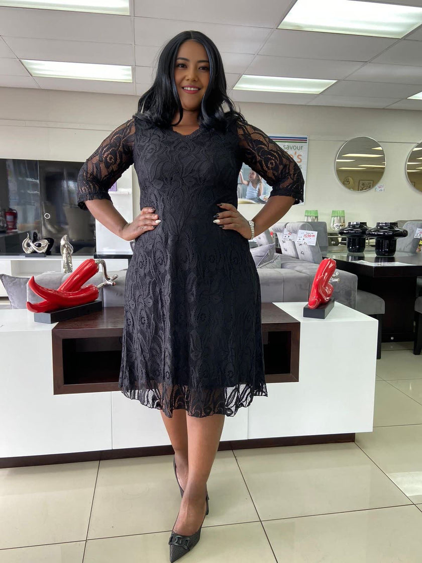 Black lace midi dress with floral overlay, 3/4 sleeves and scalloped skirt