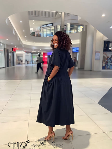 Women’s dark navy V-neck midi dress with half-button front and side pockets