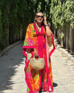 Maxi dress with tropical bird print, V-neck and puff sleeves, flowing pink and orange fabric