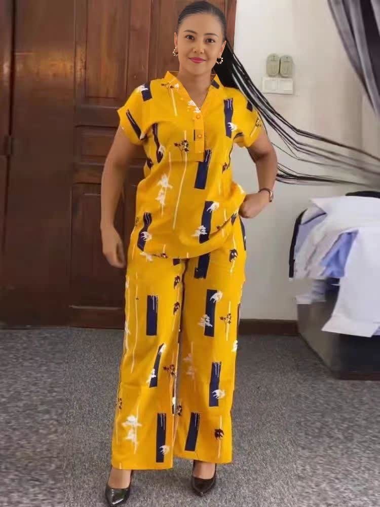 Printed twin set: short-sleeve top and long skirt, yellow with dark and white print