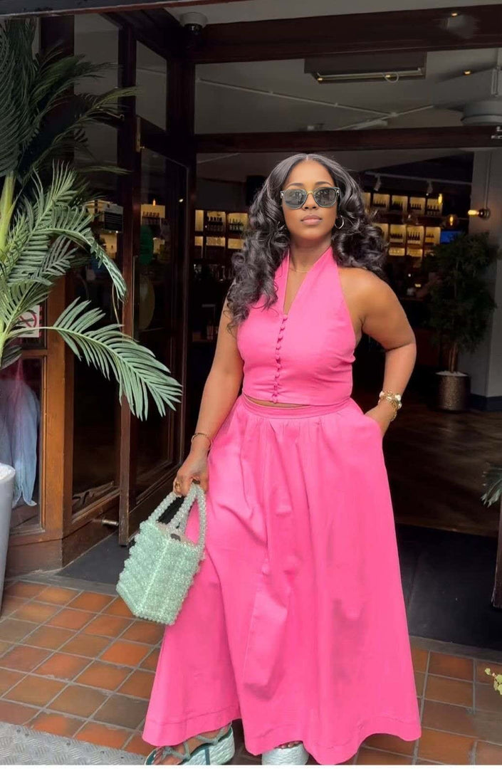 Hot-pink halter top and skirt twin set with button-front bodice and gathered waist