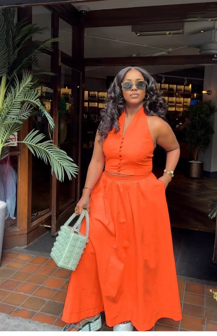 Orange halter top and skirt twin set with button-front bodice and gathered waist