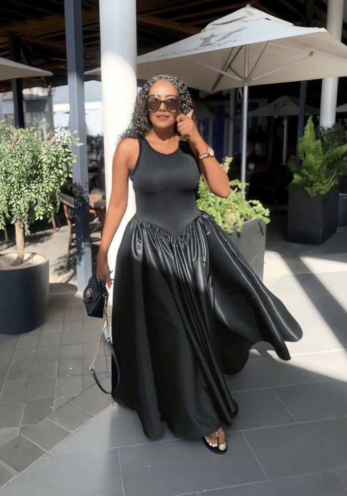 Black sleeveless maxi dress with fitted bodice and gathered skirt