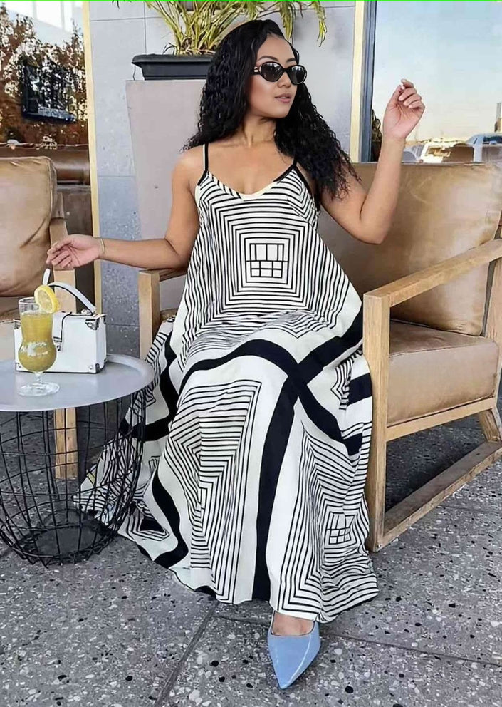 Black-and-white geometric striped maxi dress with adjustable straps, flared skirt