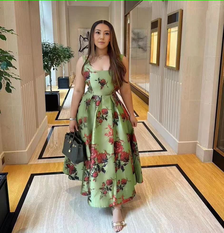 Floral green midi dress with adjustable spaghetti straps and bow-tied waist