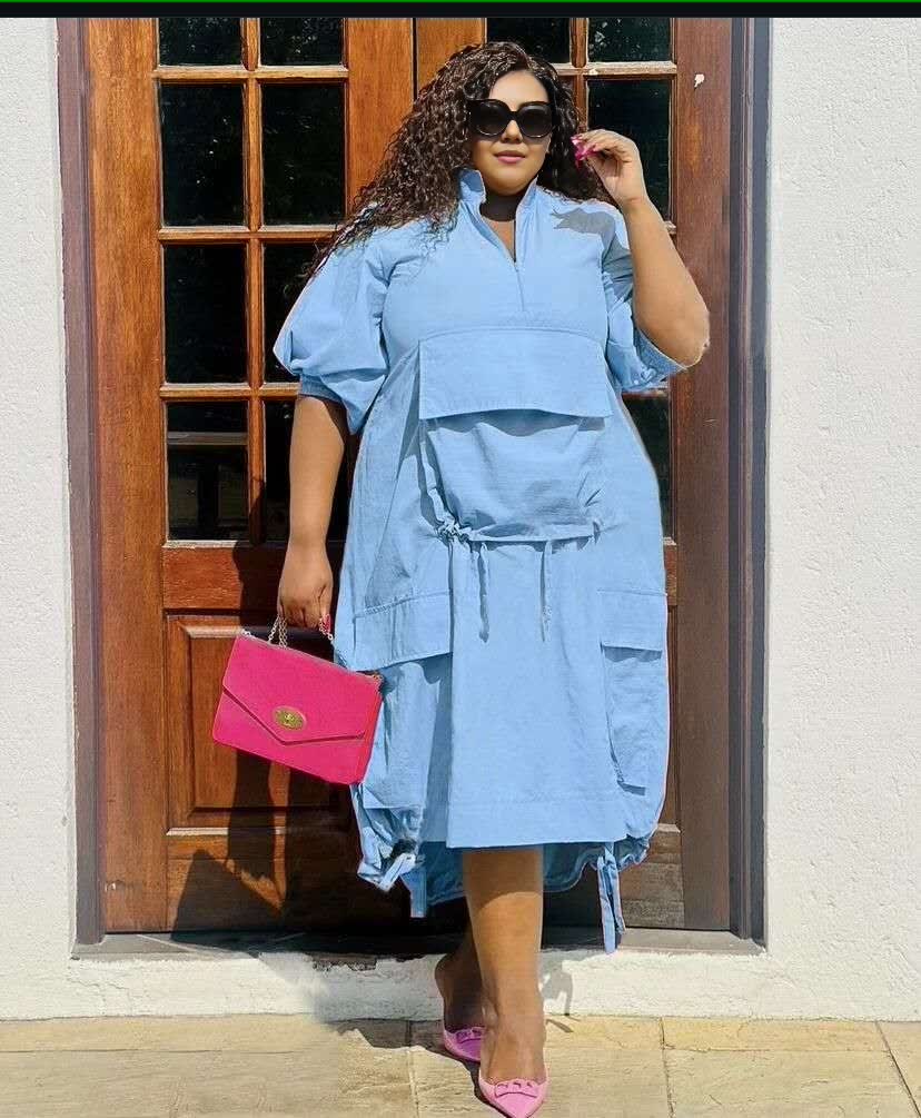 Plus-size midi dress in light blue with drawstring waist, loose fit, short sleeves, pockets