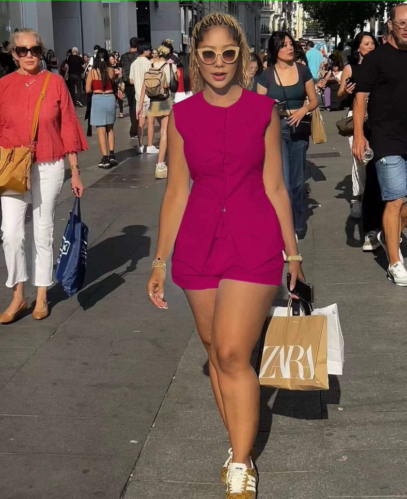 Maroon sleeveless front-tie romper with short legs and button-front