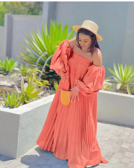 Salmon off-shoulder maxi dress with pleated skirt and puff sleeves
