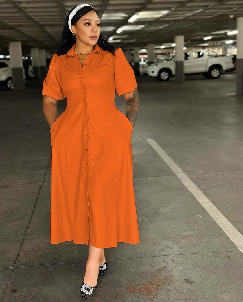 Orange midi shirt dress with puff sleeves, button front, and waist detailing