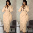 Nude midi dress with front twist and dark button placket, long sleeves