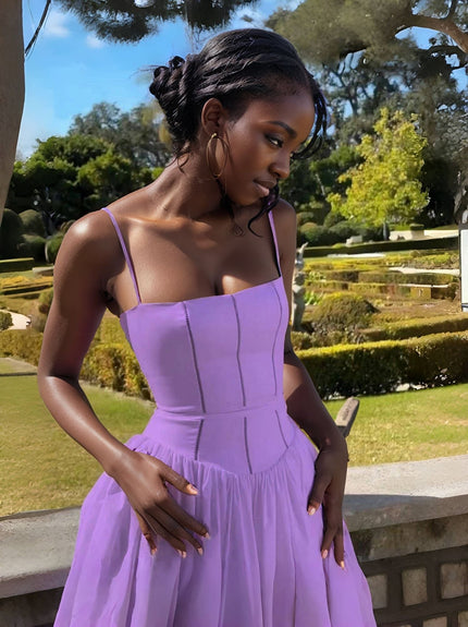 Light-purple midi dress with thin straps, fitted bodice and gathered skirt
