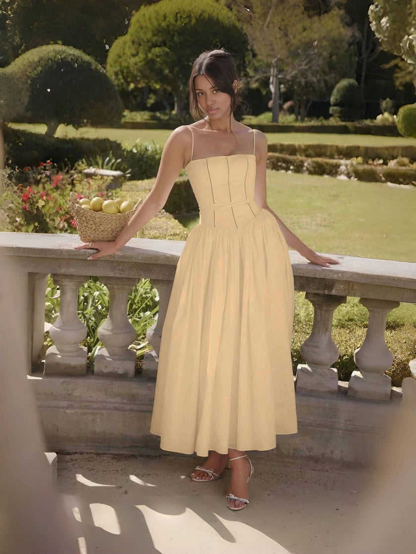 Tan midi dress with thin straps, corset-style bodice and flared skirt