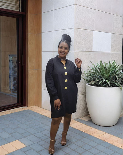 Black midi dress with five gold buttons at the front and long sleeves