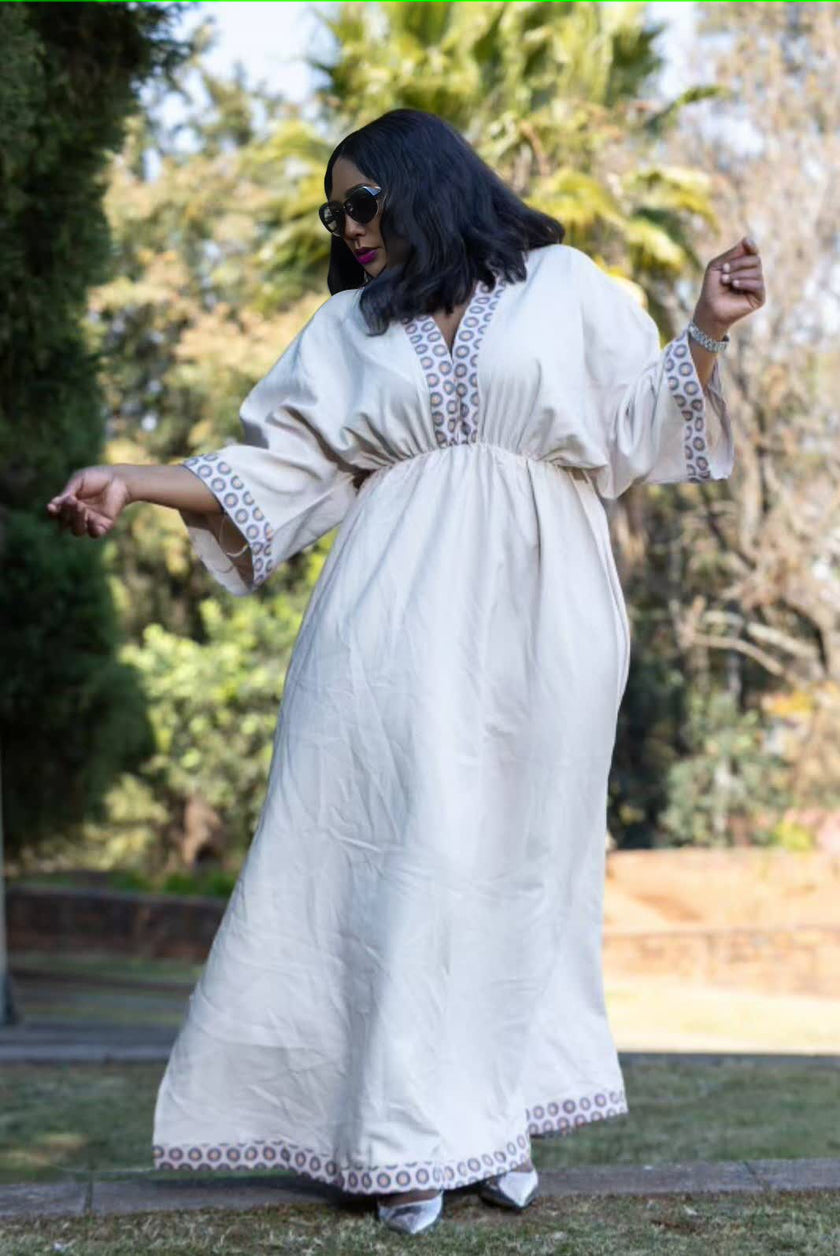 Geometric maxi dress in white with embroidered yoke and lace-trim hem