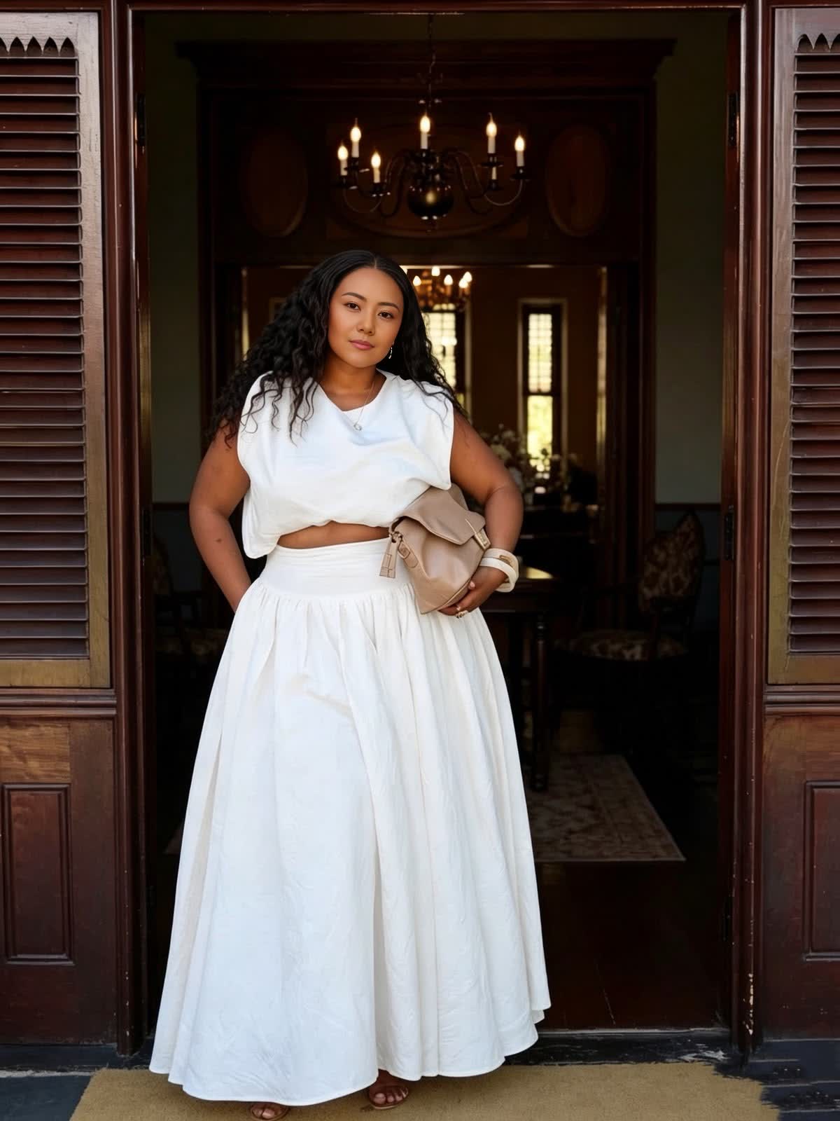 White sleeveless crop top and gathered maxi skirt two-piece set