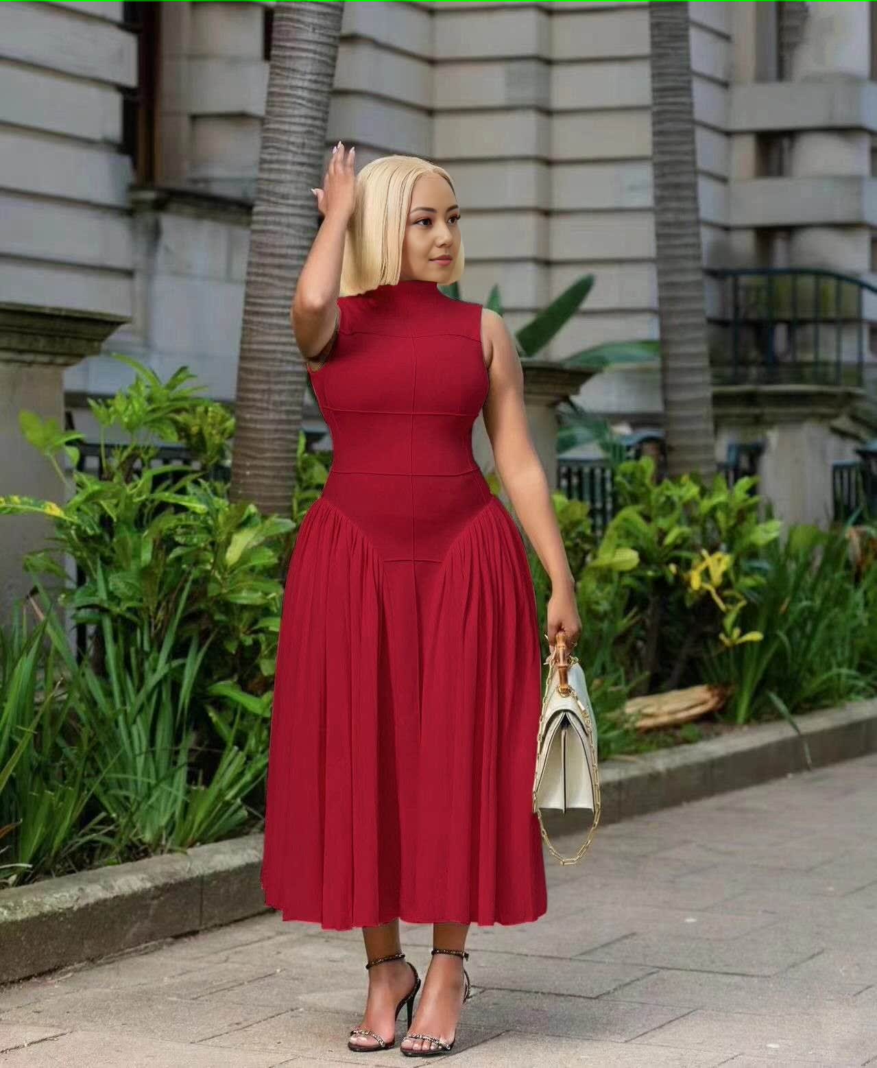 Burgundy pleated midi A-line dress with sleeveless fitted bodice and pleated skirt