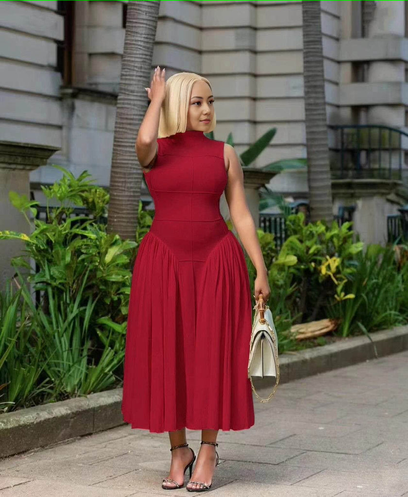 Burgundy pleated midi A-line dress with sleeveless fitted bodice and pleated skirt