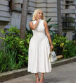White pleated midi A-line dress with sleeveless fitted bodice and gathered skirt