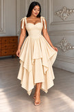 Beige tie-shoulder asymmetrical high-low midi evening dress with tiered flounce skirt.