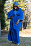 Geometric maxi dress in blue with patterned yoke, wide sleeves, and eyelet hem