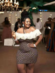 Off-shoulder ruffle dress with white shoulder frills and dark patterned body